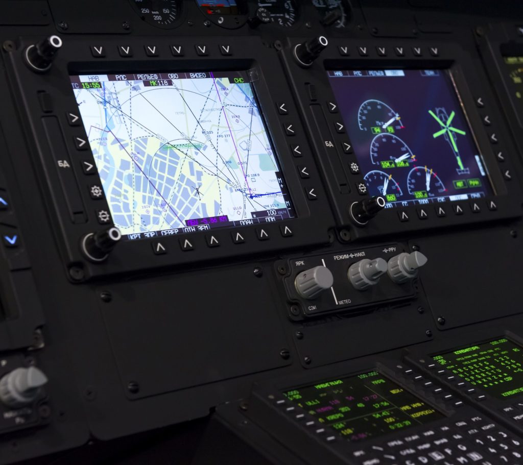 Control panel in military helicopter cockpit, copter dashboard with displays, dials, buttons, switches, faders, knobs, other toggle items, air force, modern aviation and aerospace industry